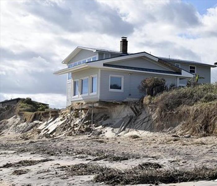 House on beach supported due to erosion